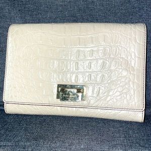 Taupe Kate spade clutch, with a strap so it can be worn as a cross body